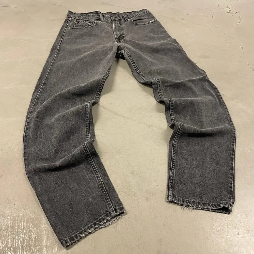 90s faded black Levi’s 550 paper tab jeans 32x33
